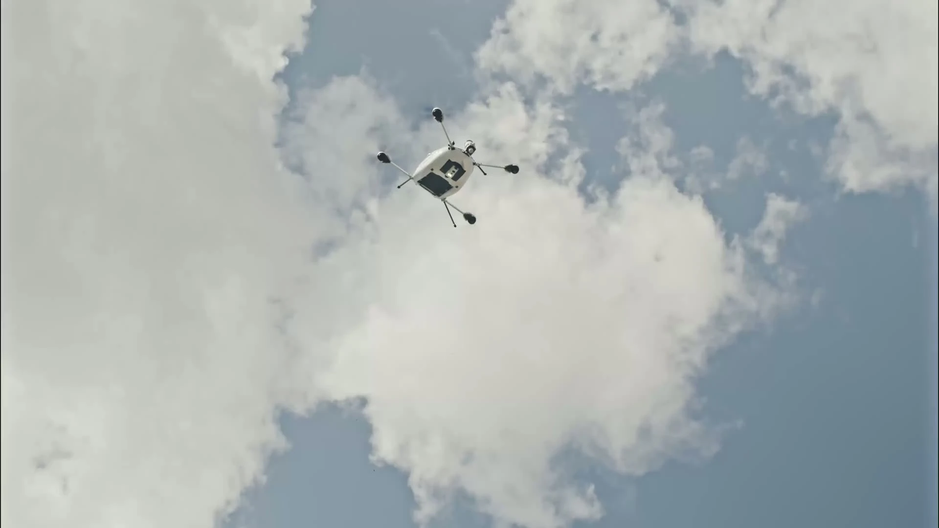 A Manna aircraft crossing a cloudy Irish sky
